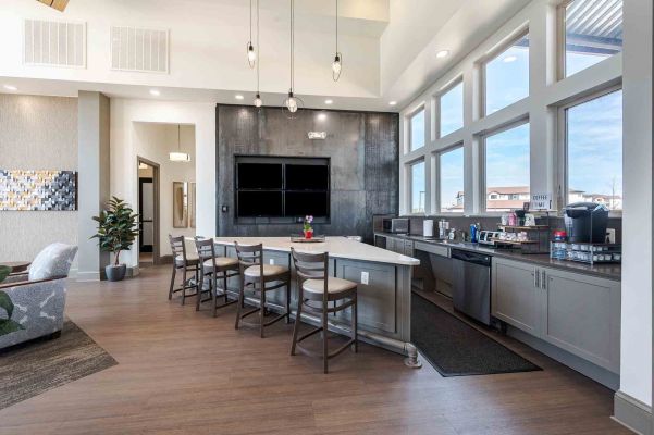 Vistas at Jackson Creek clubhouse lounge with modern fireplace and stylish seating